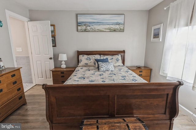 bedroom with wood-type flooring