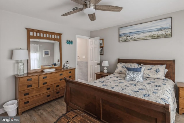 bedroom featuring ceiling fan and dark hardwood / wood-style flooring