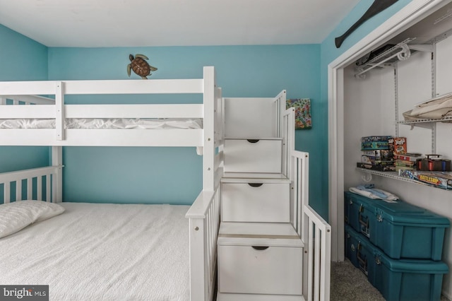 carpeted bedroom featuring a closet