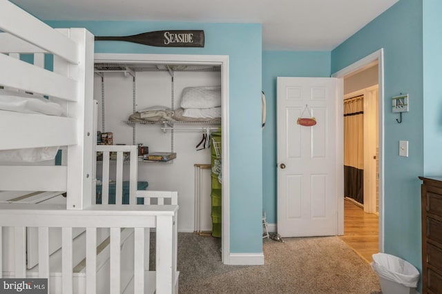 carpeted bedroom with a closet