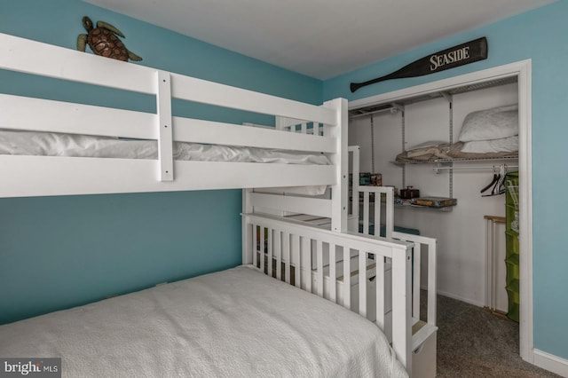 bedroom with carpet floors and a closet