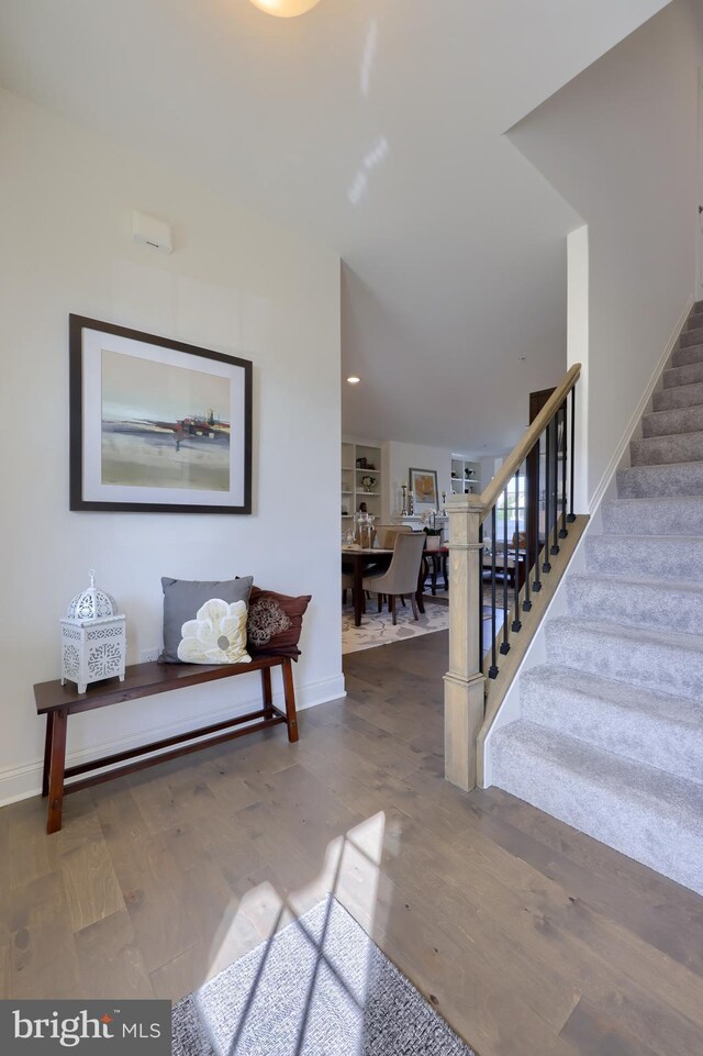 foyer entrance featuring hardwood / wood-style flooring