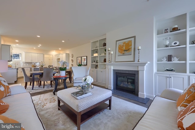 living room featuring built in shelves