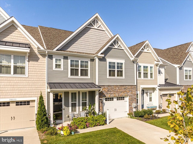 townhome / multi-family property featuring a garage