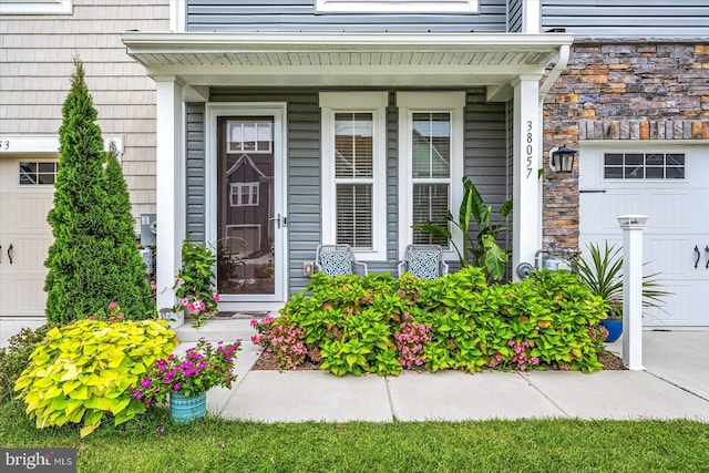 doorway to property with a garage