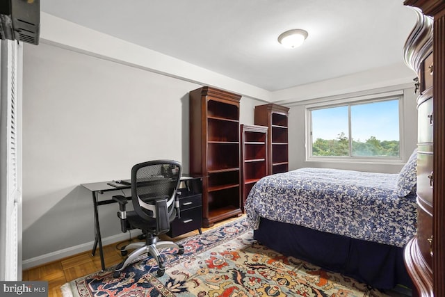 bedroom with light parquet floors