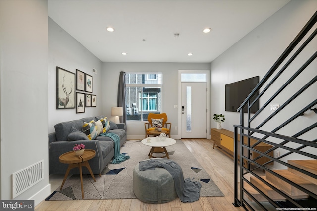 living room with light hardwood / wood-style flooring