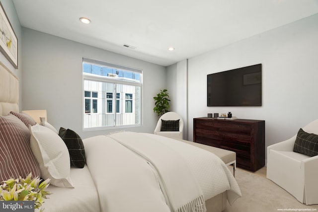 bedroom with light colored carpet