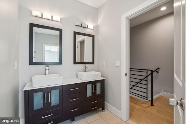 bathroom with vanity and hardwood / wood-style flooring