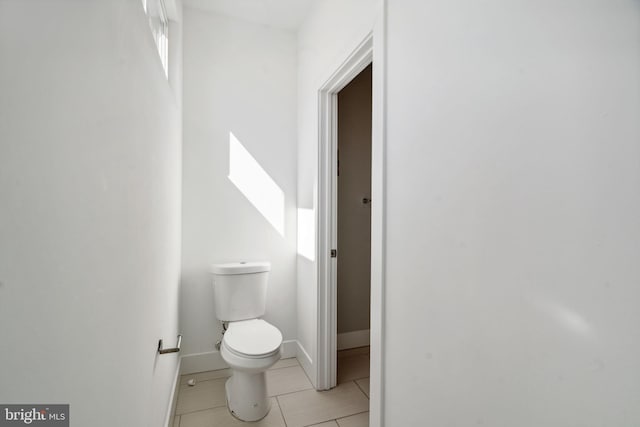 bathroom featuring toilet and tile patterned floors