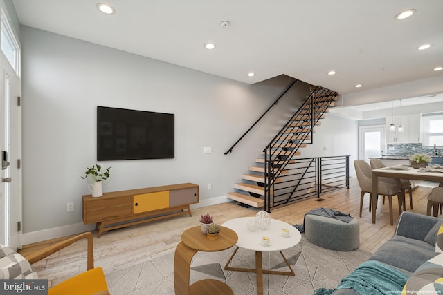 living room with plenty of natural light and light wood-type flooring