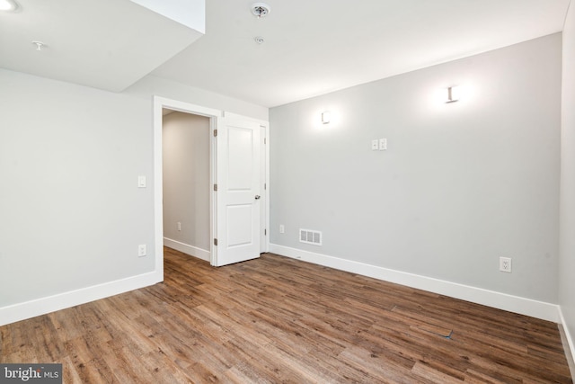 spare room featuring hardwood / wood-style flooring