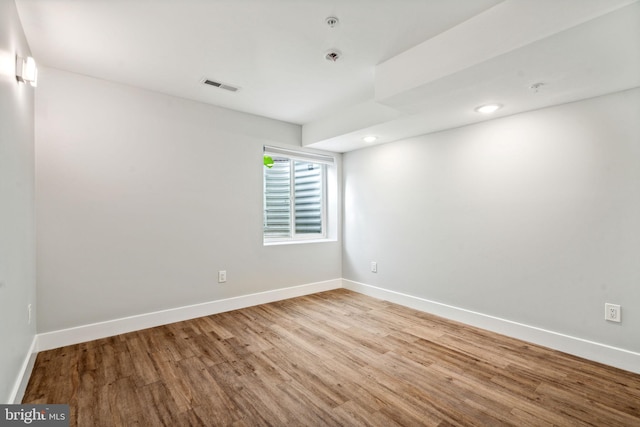 unfurnished room with light hardwood / wood-style floors