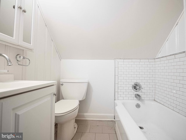 bathroom with tile patterned flooring, vanity, and toilet