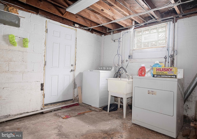 clothes washing area featuring washing machine and dryer