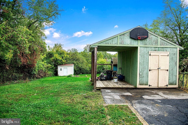 view of outbuilding featuring a yard