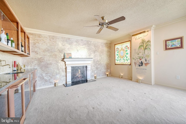 unfurnished living room featuring carpet floors, crown molding, sink, and a textured ceiling