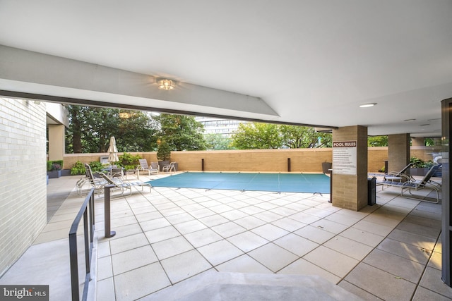 view of pool featuring a patio area