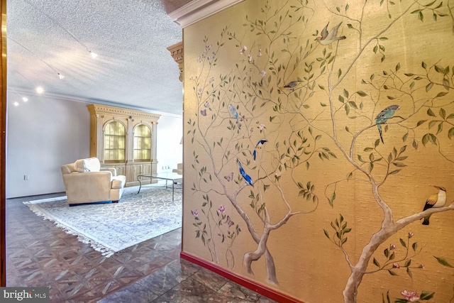 interior space featuring crown molding and a textured ceiling