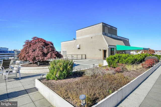 view of property exterior featuring a patio area