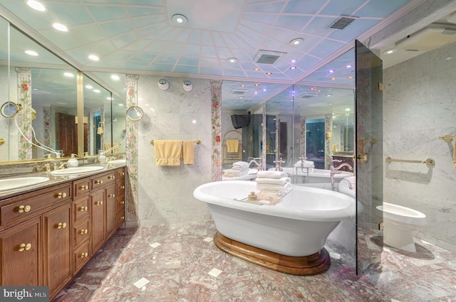 bathroom with tile walls, vanity, and a bathing tub