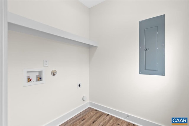 laundry area with hardwood / wood-style floors, hookup for an electric dryer, washer hookup, electric panel, and gas dryer hookup