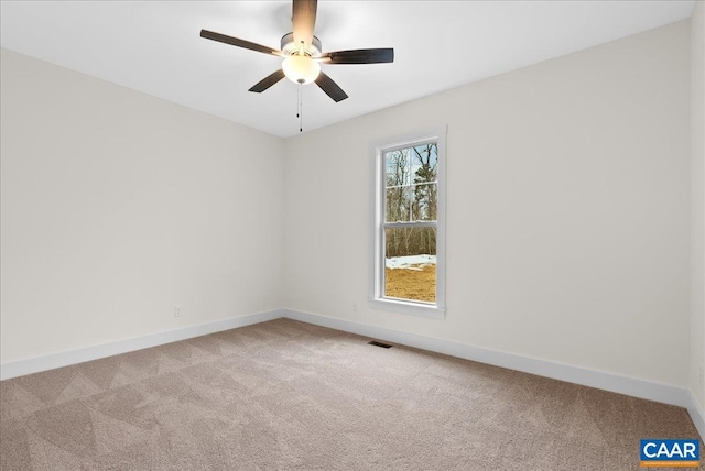 unfurnished room with light carpet and ceiling fan