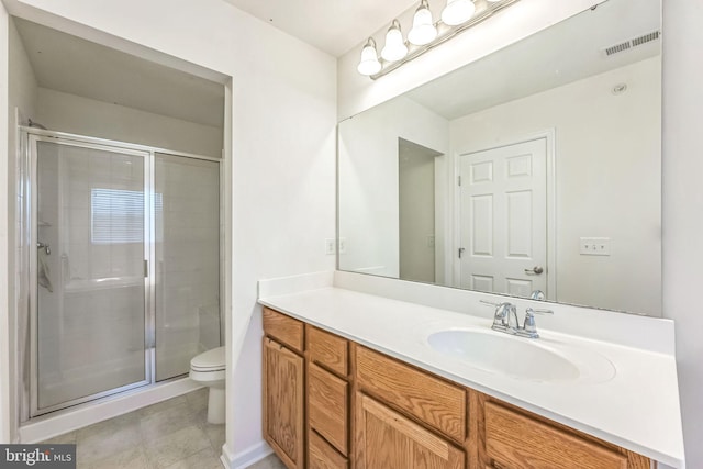 bathroom with walk in shower, vanity, and toilet