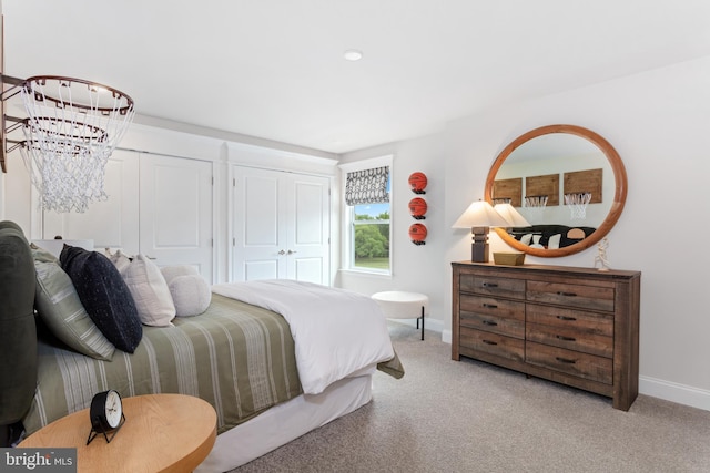 bedroom featuring light colored carpet