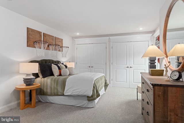 bedroom with light colored carpet