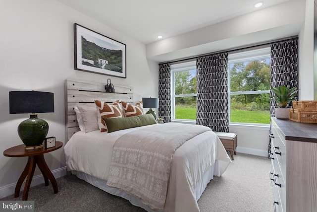 bedroom with light colored carpet