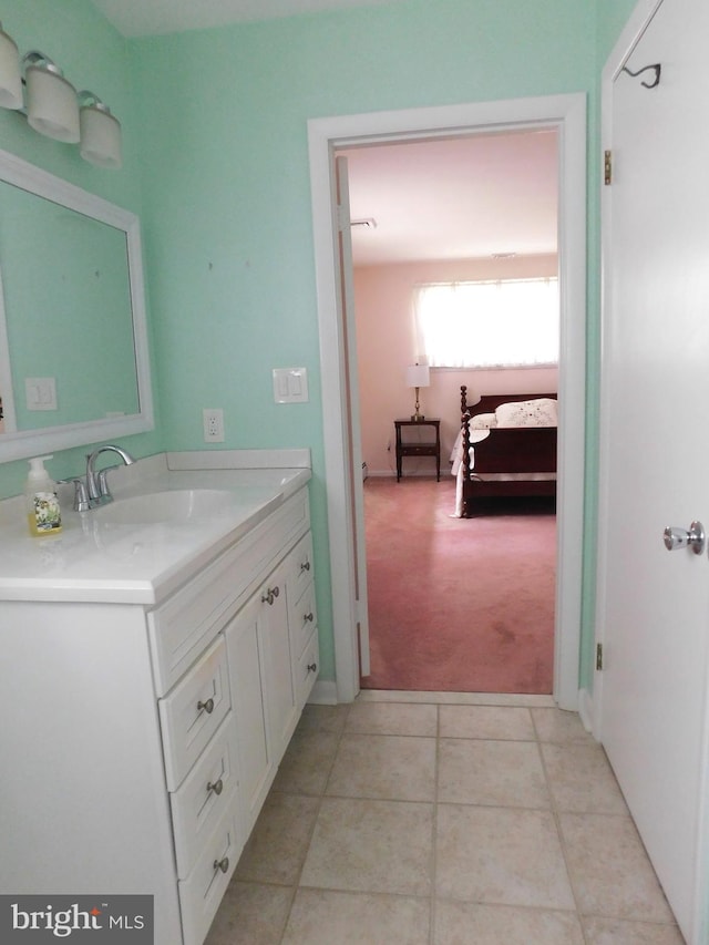 bathroom with tile patterned flooring and vanity