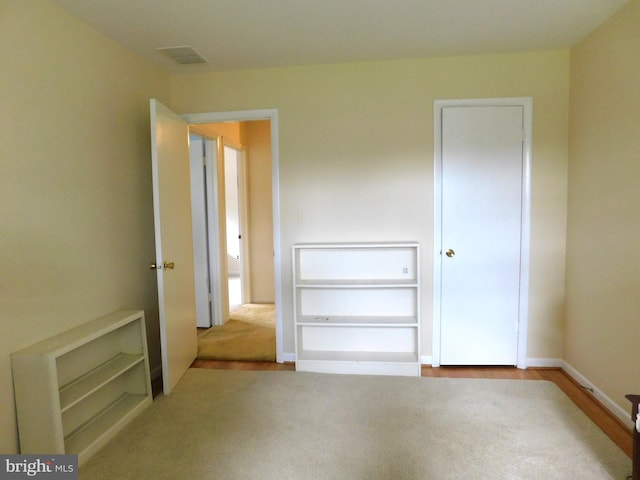 unfurnished bedroom with carpet floors