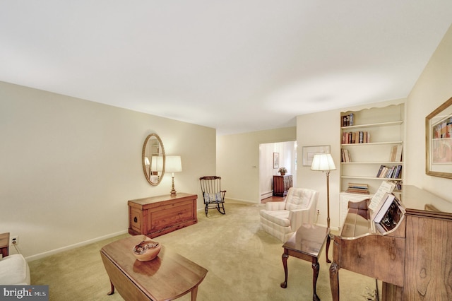 living area featuring carpet floors and baseboards