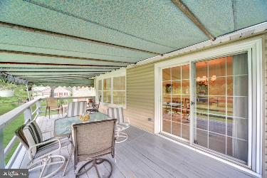 wooden deck with outdoor dining space