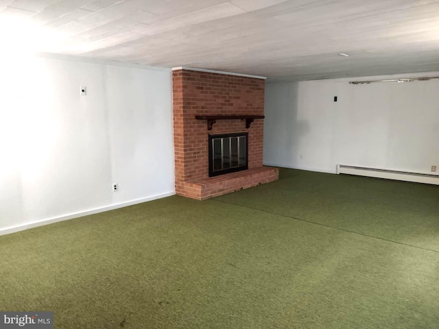 unfurnished living room featuring carpet flooring, a baseboard heating unit, a fireplace, and baseboards