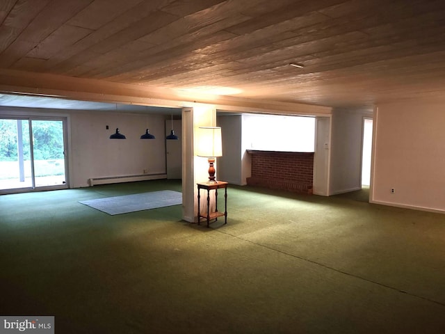 basement featuring wood ceiling, a baseboard heating unit, a fireplace, carpet flooring, and baseboards