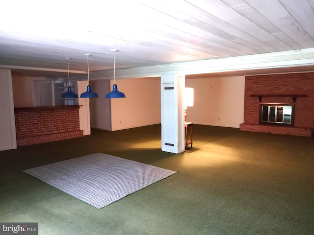 finished below grade area with carpet flooring and a brick fireplace