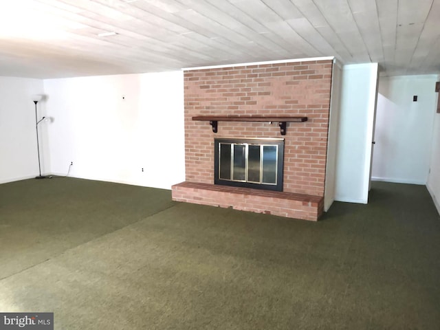 unfurnished living room featuring carpet and a brick fireplace