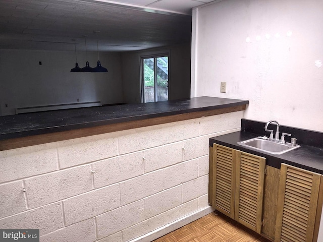 bar featuring baseboard heating and a sink
