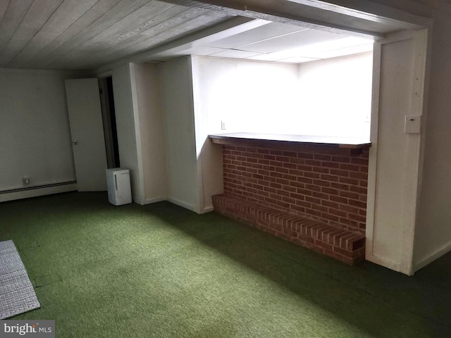 below grade area with carpet flooring and a baseboard radiator