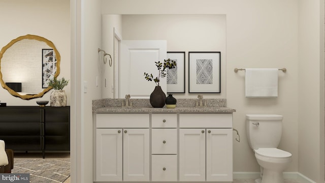 bathroom with vanity and toilet