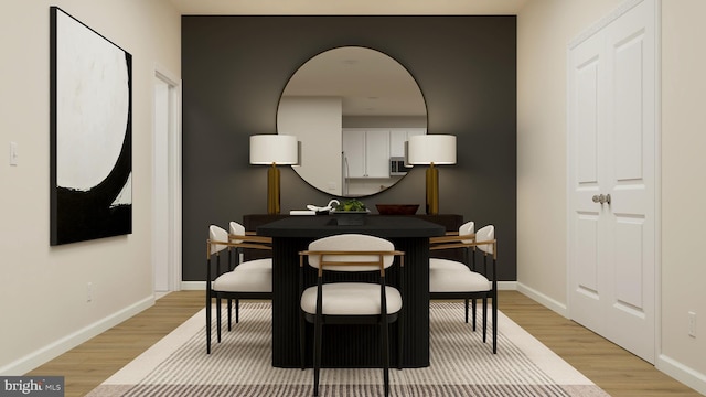 dining space featuring light hardwood / wood-style flooring