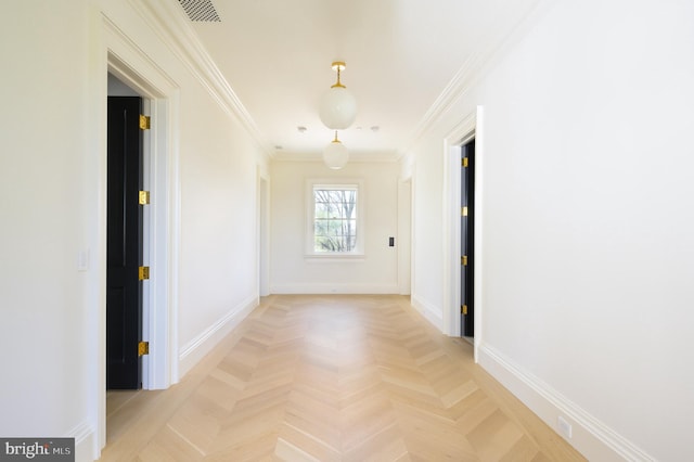 hallway with crown molding and light parquet flooring