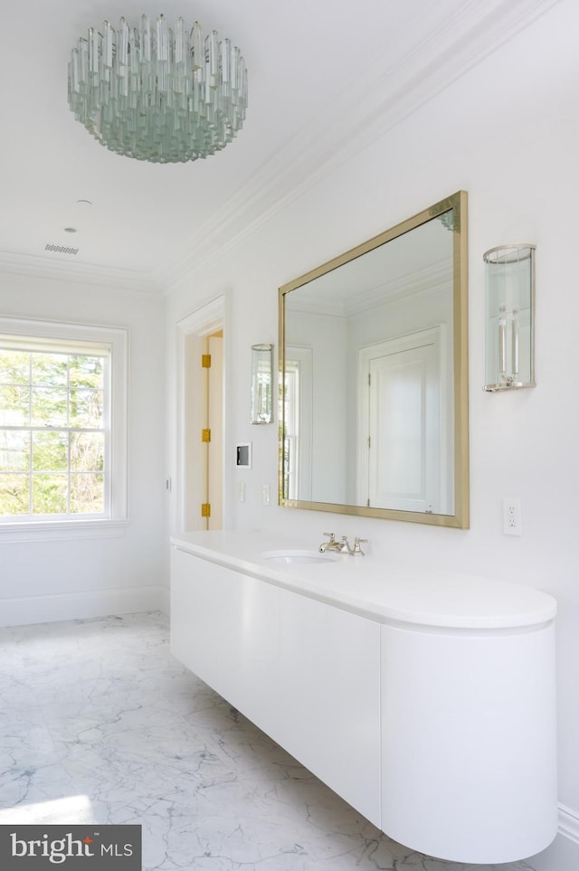 bathroom featuring vanity and ornamental molding