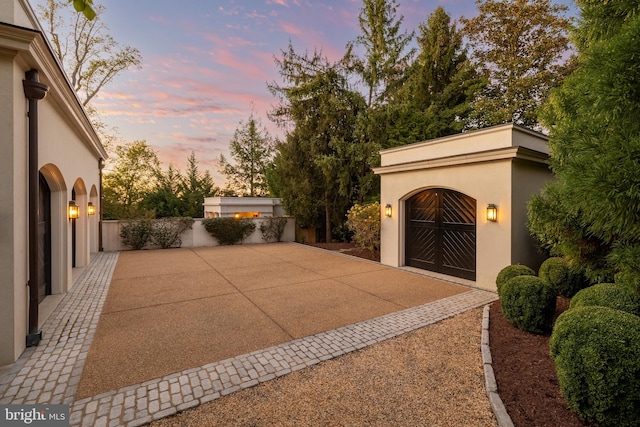 view of patio terrace at dusk