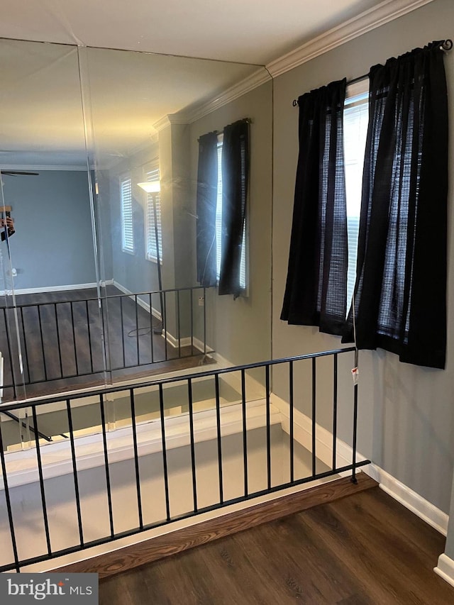 staircase with hardwood / wood-style flooring and crown molding