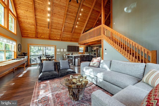 living room featuring wooden ceiling, wood-type flooring, beam ceiling, and high vaulted ceiling