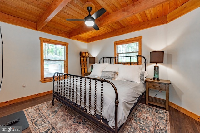 bedroom featuring ceiling fan, hardwood / wood-style flooring, and multiple windows