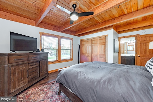 bedroom with ceiling fan, beamed ceiling, dark hardwood / wood-style floors, wooden ceiling, and ensuite bath